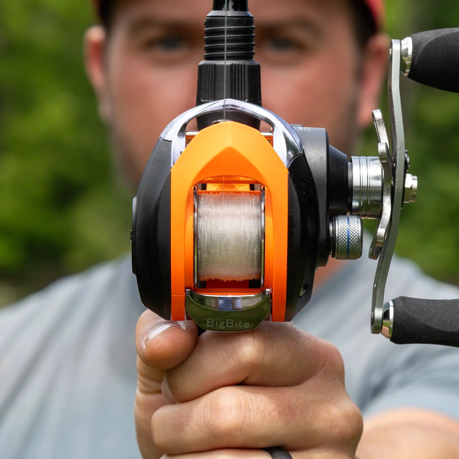 Reaction Tackle 100% Pure fluorocarbon fishing line on orange and black reel on Tampa Home & Garden Store