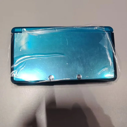 Refurbished blue 3DS handheld gaming console in protective plastic wrap back view on Tampa Home & Garden Store