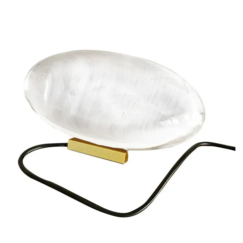 Eye Of The Sky crystal table lamp with clear oval orb, gold base, LED lighting, black cord on Tampa Home & Garden Store