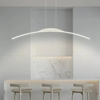 DecorBites LED Pendant Lamp curved arc over marble backsplash island with white stools on Tampa Home & Garden Store