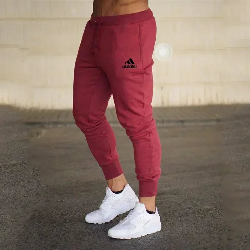 Men joggers pants maroon with drawstring waist, cuffed hems, Adidas logo on thigh on Tampa Home & Garden Store