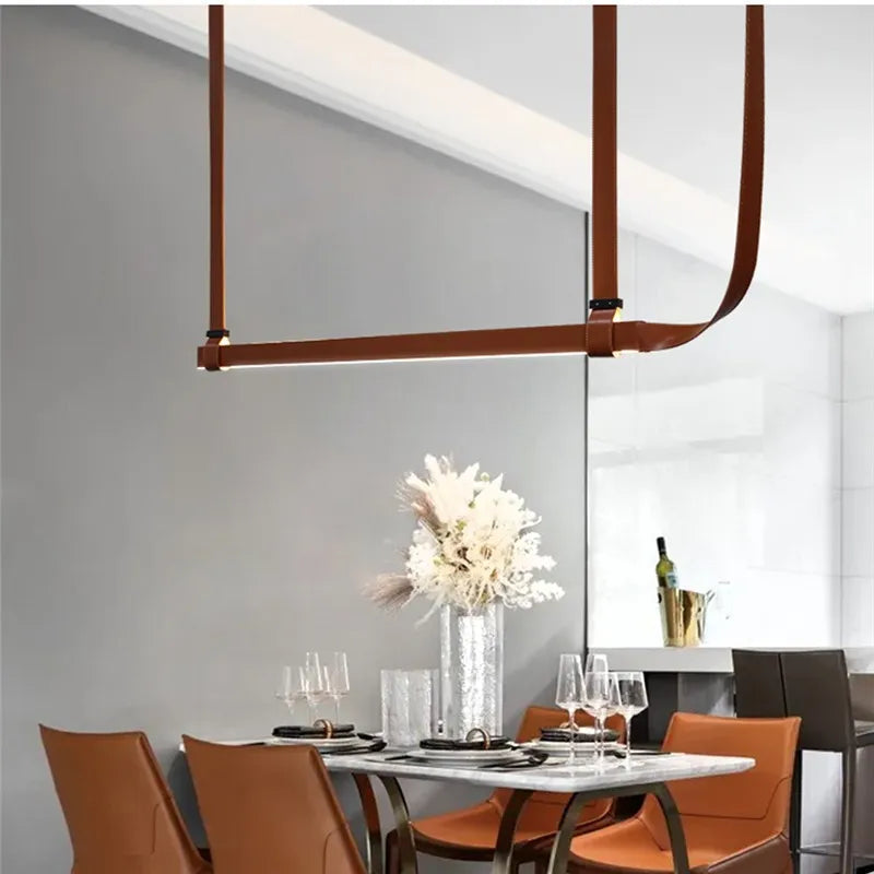 DecorBites LED Art Deco chandelier in brown leather straps over a marble dining table on Tampa Home & Garden Store