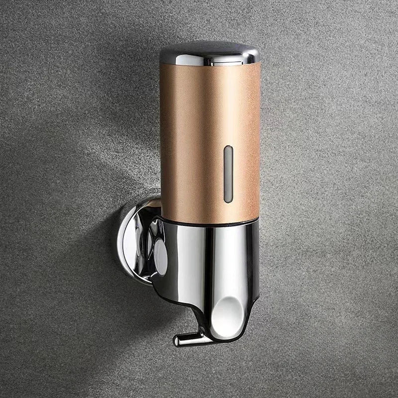 Wall mounted shampoo and soap dispenser with bronze-gold body and chrome accents on Tampa Home & Garden Store