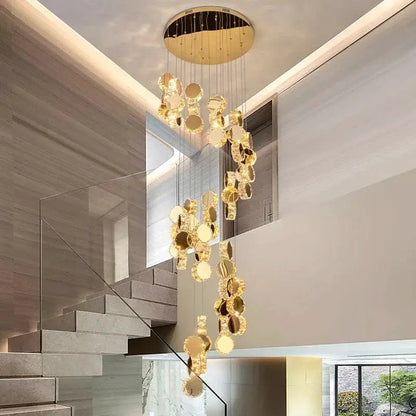Decorbites LED pendant chandelier with cascading gold discs in a modern living-dining area on Tampa Home & Garden Store