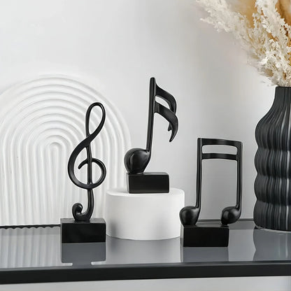 Perfecsy 3-piece black metal music-note sculpture set on square pedestals on Tampa Home & Garden Store