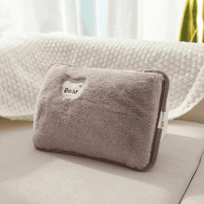 Rechargeable hand warmer in gray plush with bear patch by Silcy Skin on Tampa Home & Garden Store
