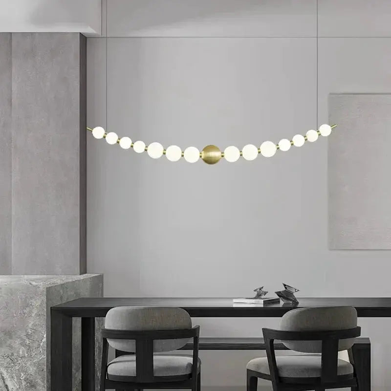 Decorbites LED pendant chandelier with white globe bulbs and brass center orb on Tampa Home & Garden Store