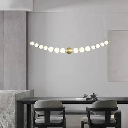 Decorbites LED pendant chandelier with white globe bulbs and brass center orb on Tampa Home & Garden Store