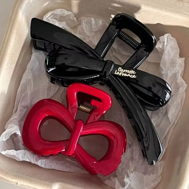 2-piece hair clip set: black glossy bow shark-claw clamp and red bow hairpin on Tampa Home & Garden Store