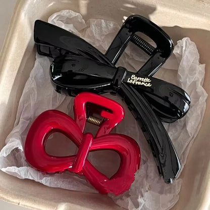 2-piece hair clip set: black glossy bow shark-claw clamp and red bow hairpin on Tampa Home & Garden Store