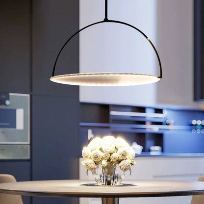 DecorBites Kepler Fabric Pendant Lamp over a round dining table with white roses centerpiece on Tampa Home & Garden Store