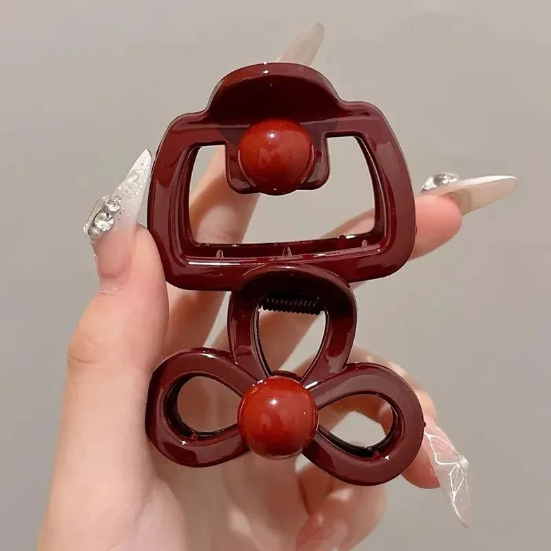2pc burgundy hair clips set with shark clamps; bow and flower clips with red centers on Tampa Home & Garden Store