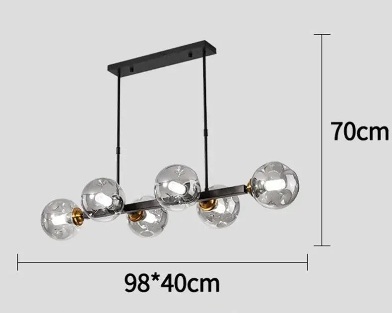 DecorBites LED pendant chandelier with 6 clear glass globes on a black bar, gold accents on Tampa Home & Garden Store