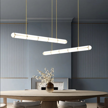 DecorBites Pendant Lights with white diffusers and gold hardware over a round dining table on Tampa Home & Garden Store