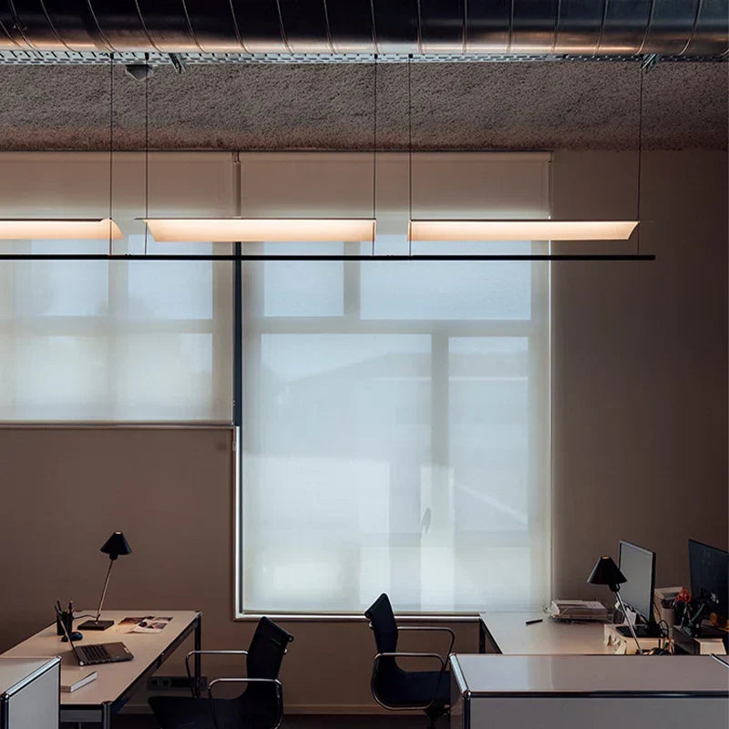 DecorBites pendant lights linear white hanging lamps over modern loft office desks on Tampa Home & Garden Store