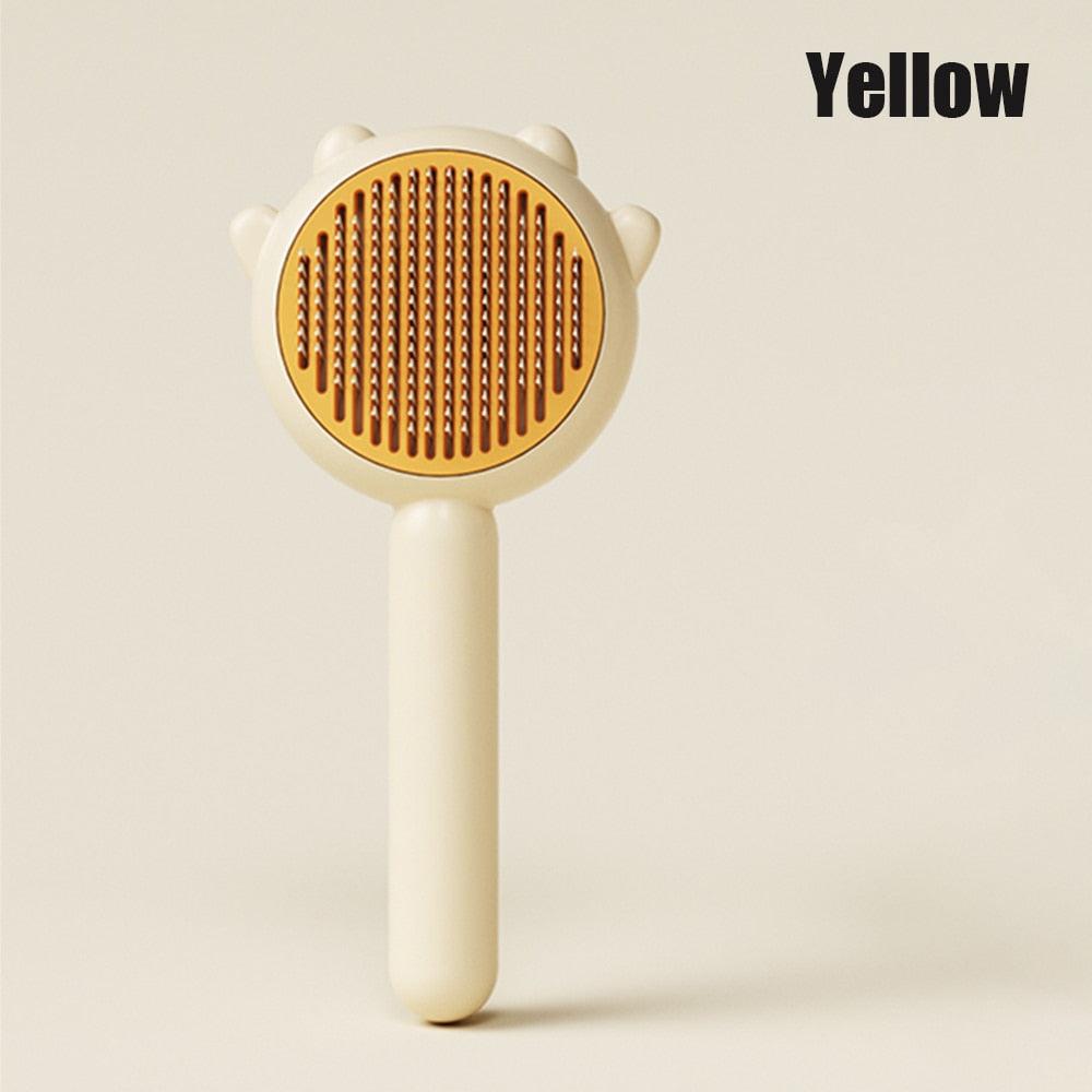 Cat comb massage brush with yellow head and cream handle for dogs and cats grooming tool on Tampa Home & Garden Store