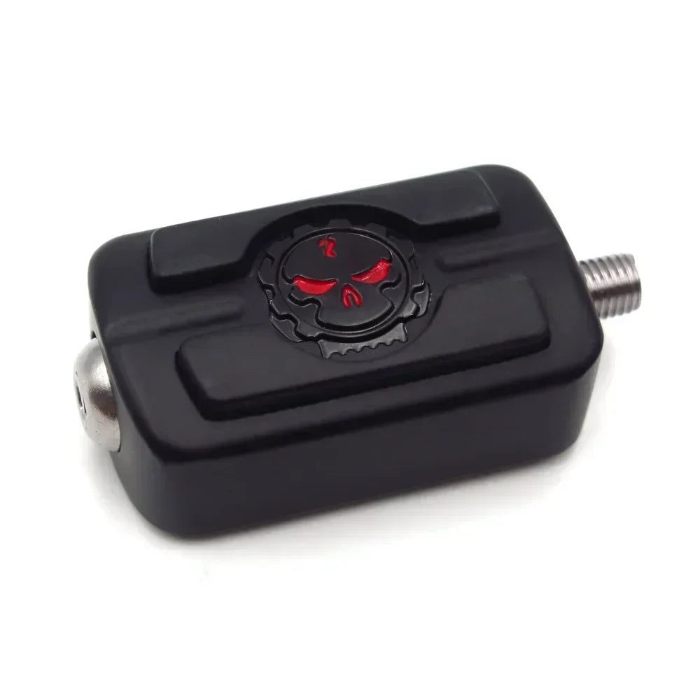 Black motorcycle shifter foot peg with red skull emblem on Tampa Home & Garden Store