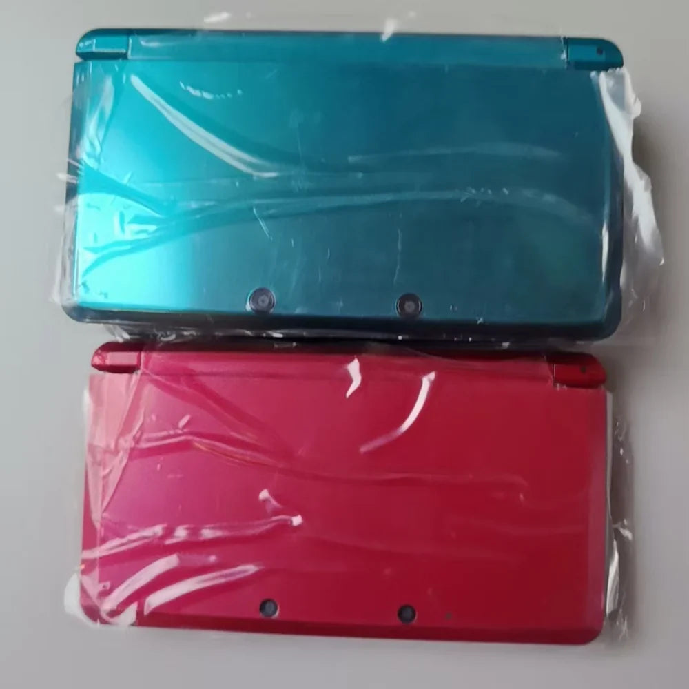 Refurbished 3DS handheld consoles, turquoise blue and pink, two units in plastic wrap by FLIPSTYLEZLLC on Tampa Home & Garden Store