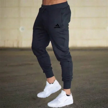 Men's black baggy jogger pants with Adidas logo, drawstring waist, tapered cuffs on Tampa Home & Garden Store