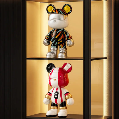 Bear ceramic money bank figures top multicolor bear, bottom red-white striped bear on Tampa Home & Garden Store