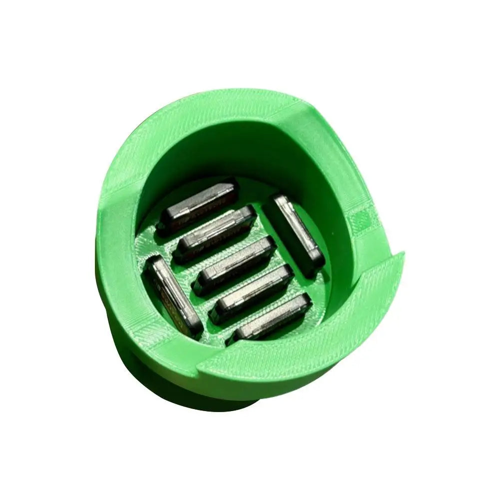 Green circular game controller charging dock with metal pins for Switch and Xbox on Tampa Home & Garden Store