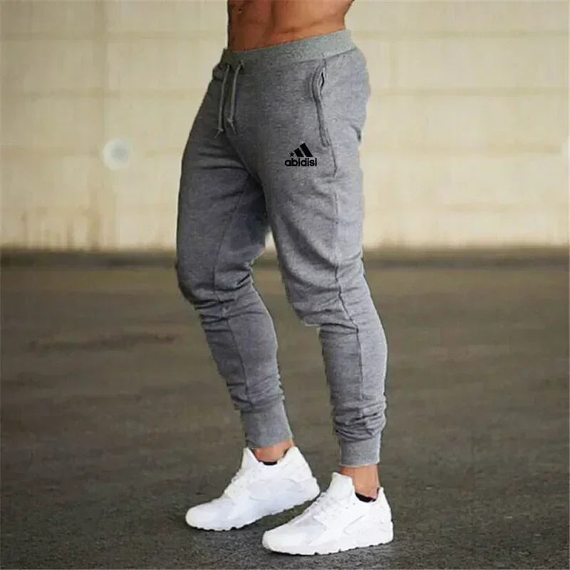 Men's grey jogger sweatpants with Adidas logo, drawstring waist, cuffed ankles on Tampa Home & Garden Store