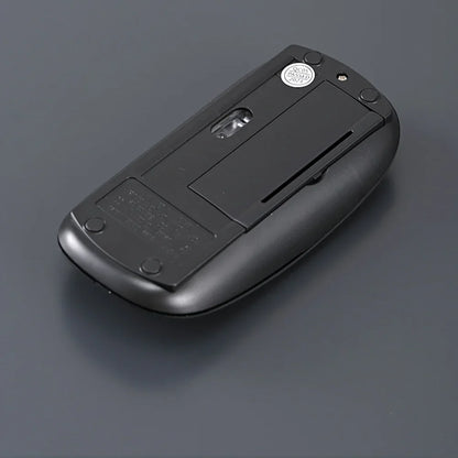 Black wireless mouse bottom view showing battery cover and sensor window for compact gaming on Tampa Home & Garden Store