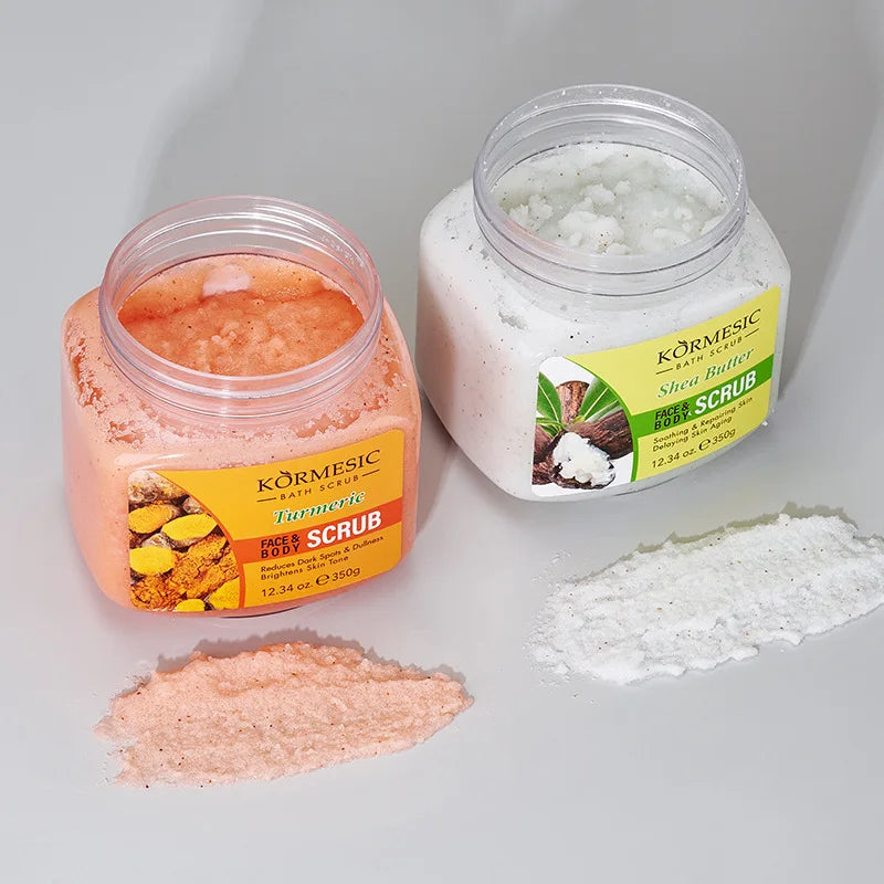 Two KORMESIC bath scrubs by Silcy Skin: turmeric orange and shea butter white jars on Tampa Home & Garden Store