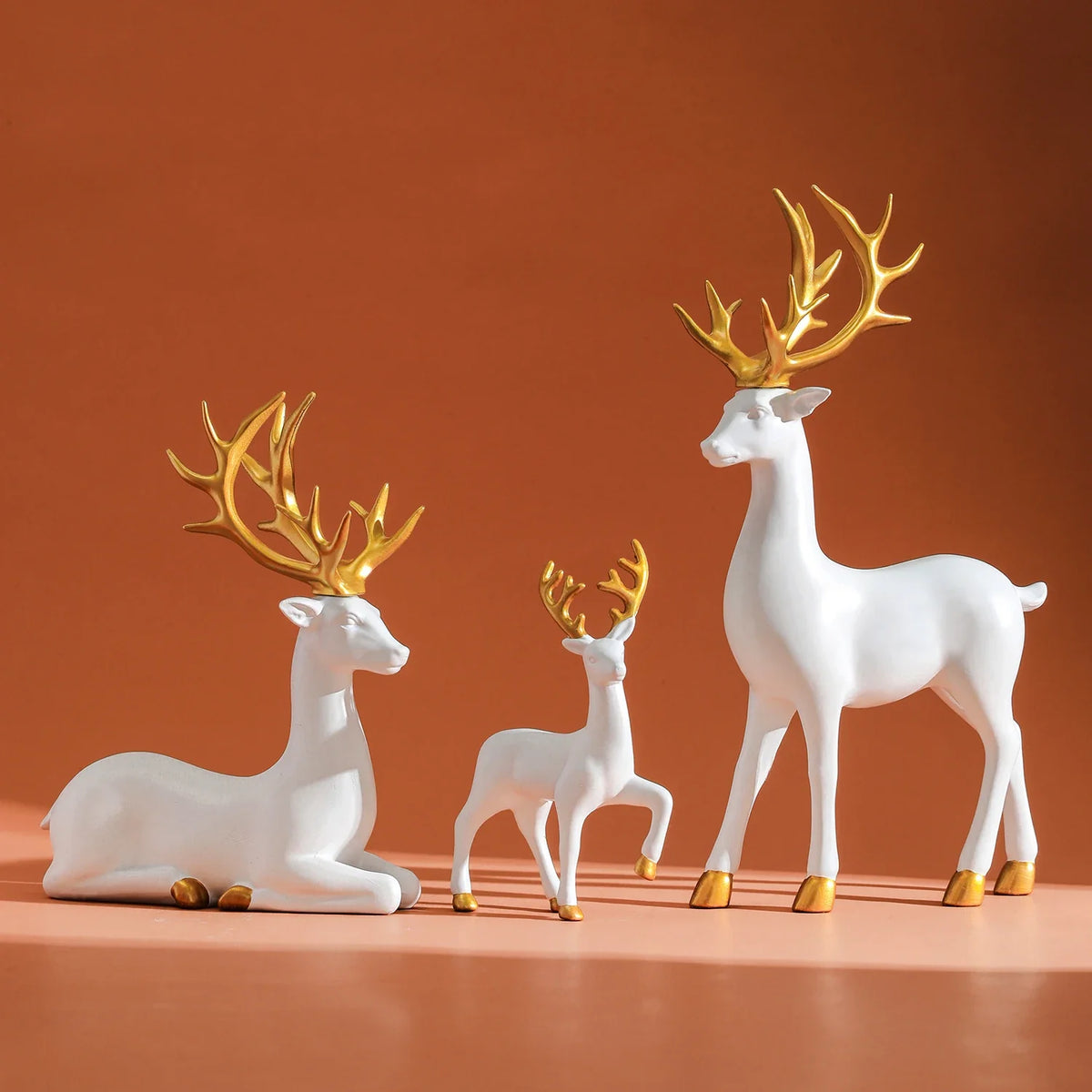 3-piece white resin deer figurine set with gold antlers for Christmas decor on Tampa Home & Garden Store