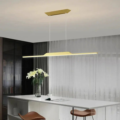 DecorBites LED pendant lamp gold-tone rectangular light suspended over white dining table on Tampa Home & Garden Store