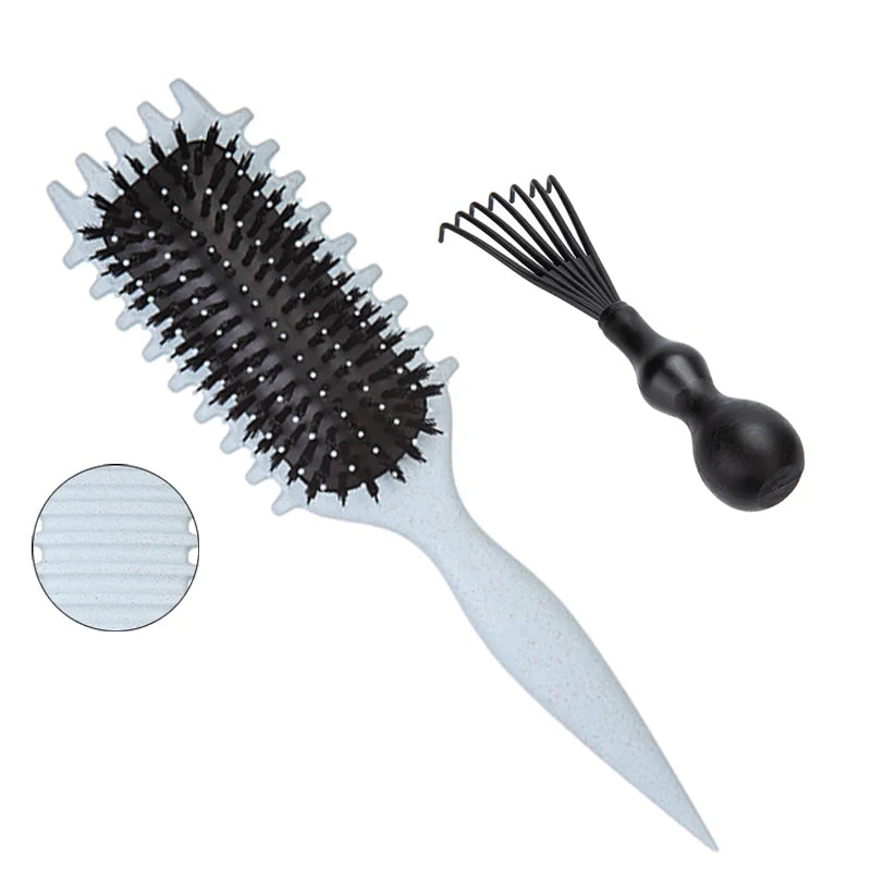 Detangling candy brush with white speckled handle and black bristles and cleaning claw on Tampa Home & Garden Store