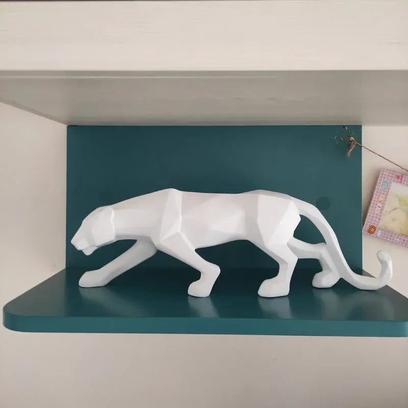White geometric panther statue in resin, abstract leopard decor on teal shelf on Tampa Home & Garden Store
