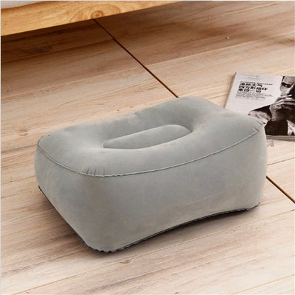 Inflatable wedge pillow in light gray with opening for ergonomic support on wooden floor on Tampa Home & Garden Store