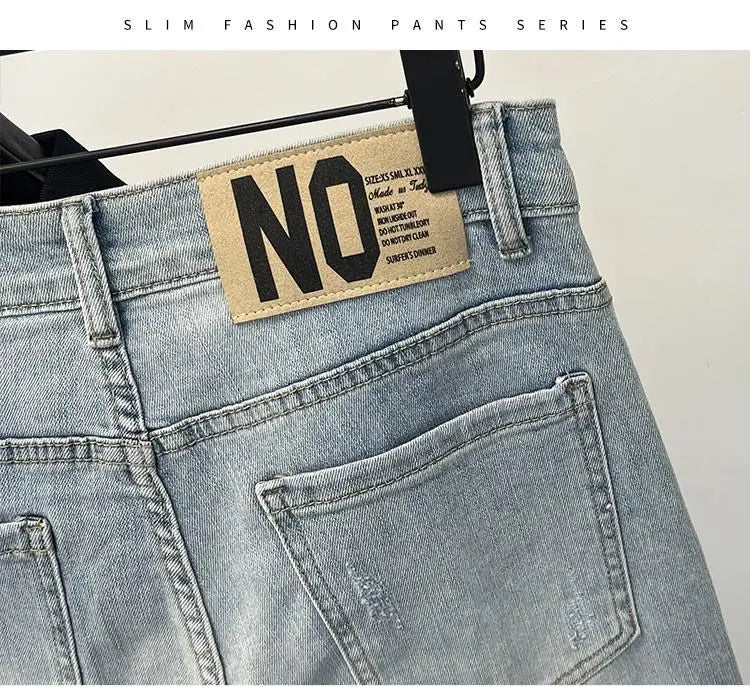 Men skinny jeans in light denim with back pocket and beige leather patch on waistband on Tampa Home & Garden Store