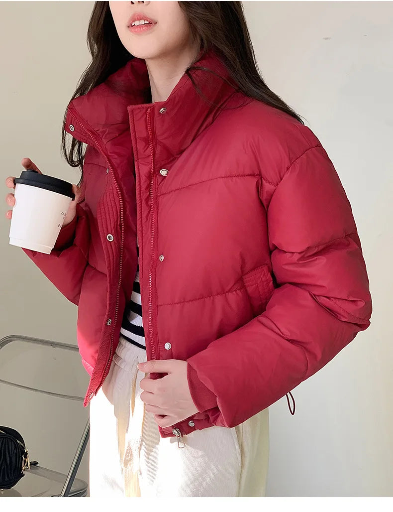Women cropped cotton-padded red puffer jacket by UpTrend Deals, worn with a coffee cup on Tampa Home & Garden Store