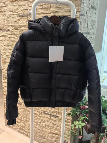 Black hooded puffer jacket for women, thick warm quilted coat on display on Tampa Home & Garden Store