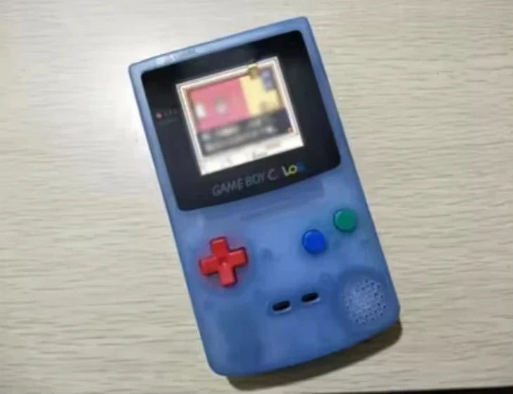 Blue Game Boy Color console with red D-pad, green A button and blue B button, IPS backlit on Tampa Home & Garden Store