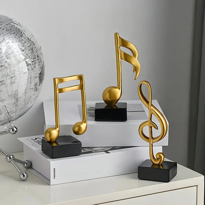 3-piece gold music note sculpture set with black bases, modern decorative statues on Tampa Home & Garden Store