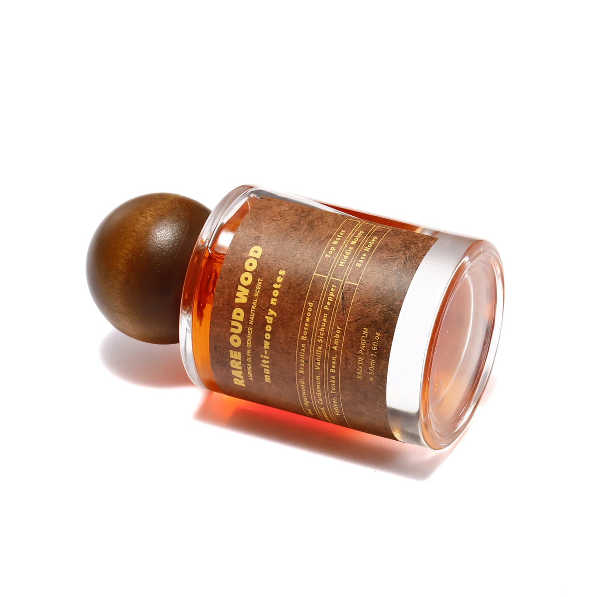 Arabian Oud perfume bottle with amber liquid and wooden cap, unisex woody spicy fragrance notes on Tampa Home & Garden Store