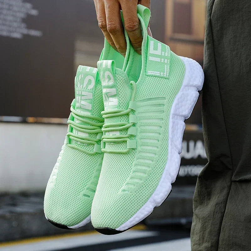 Pair of training sneakers EstaliosFit in mint green breathable mesh with white cushioned sole on Tampa Home & Garden Store