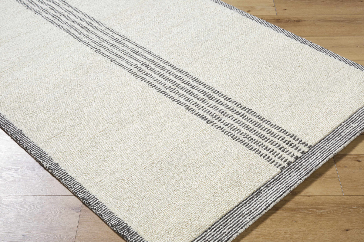 Ande Ivory Area Rug by Boutique Rugs with gray striped border on ivory field on Tampa Home & Garden Store