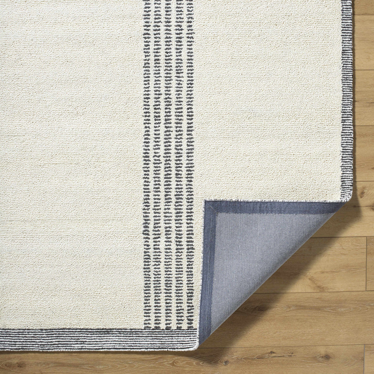 Ande Ivory Area Rug by Boutique Rugs, ivory field with black striped border, clearance on Tampa Home & Garden Store