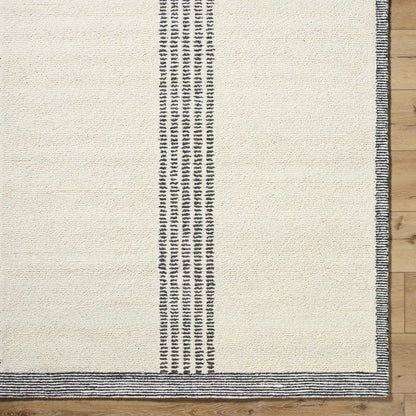 Ande Ivory Area Rug with vertical black stripe motif and striped border on ivory field on Tampa Home & Garden Store