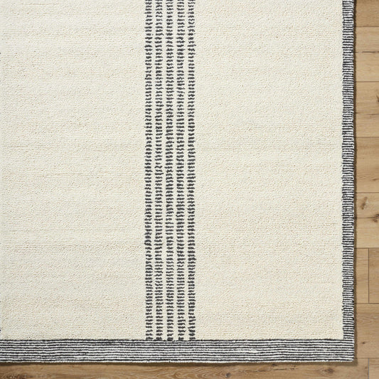 Ande Ivory Area Rug with vertical black stripe motif and striped border on ivory field on Tampa Home & Garden Store