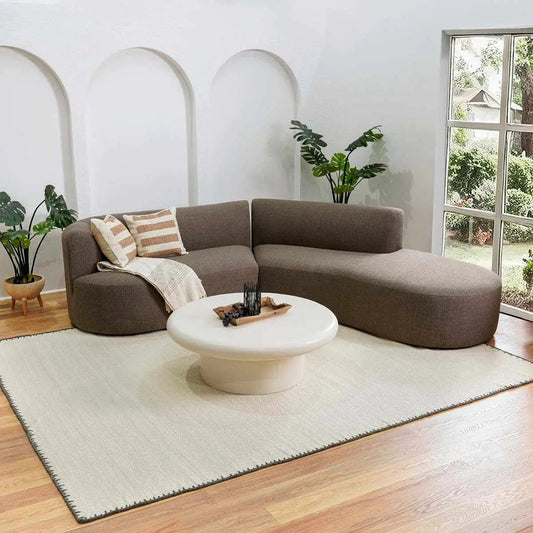 Ayumu Off White Hand Woven Wool Area Rug by Boutique Rugs in a modern living room on Tampa Home & Garden Store