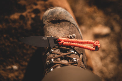 Ultralight Ridge Blade knife with orange paracord lanyard and Ridge Belts logo on black blade on Tampa Home & Garden Store