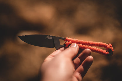 Ridge Belts Ultralight Ridge Blade knife with black serrated blade and orange paracord wrap on Tampa Home & Garden Store