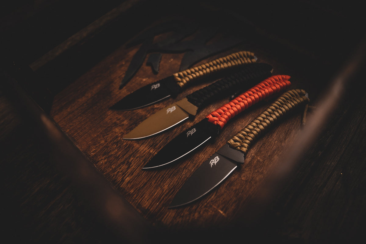 Ultralight Ridge Blade knives by Ridge Belts four with tan, black and red paracord handles on Tampa Home & Garden Store