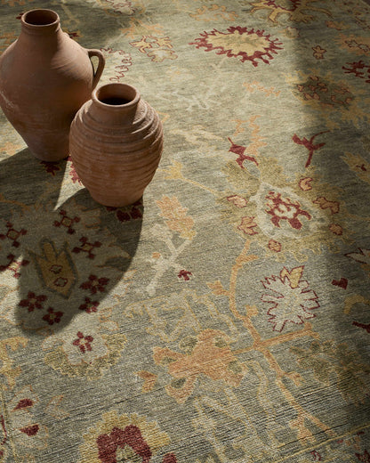 Cian Area Rug Boutique Rugs, beige earth-toned vintage motif; two terracotta vases on Tampa Home & Garden Store
