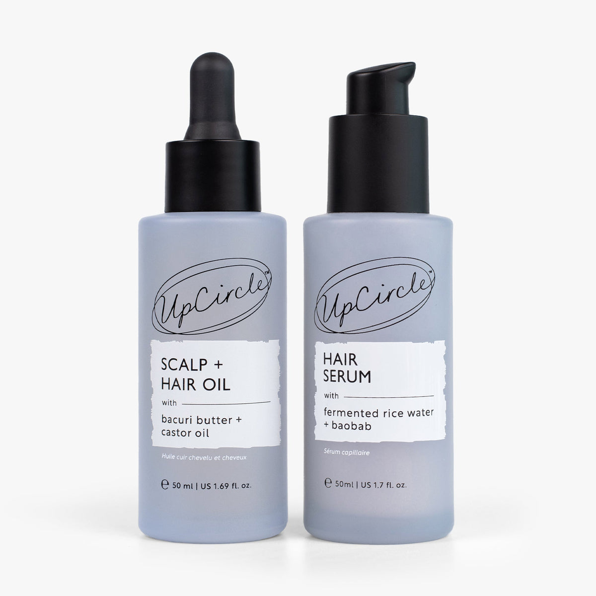 UpCircle hair care duo: scalp and hair oil and hair serum bottles in gray with black pumps on Tampa Home & Garden Store